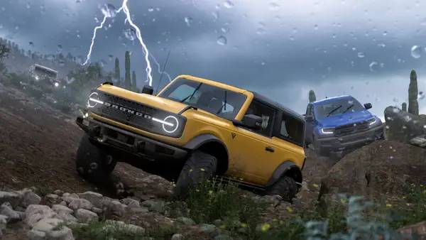 Кадр с взаимодействием персонажа и объекта в Forza Horizon 5